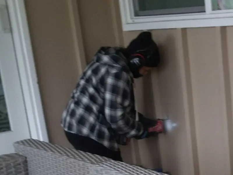 Professional electrician installing an exterior outlet in Amory