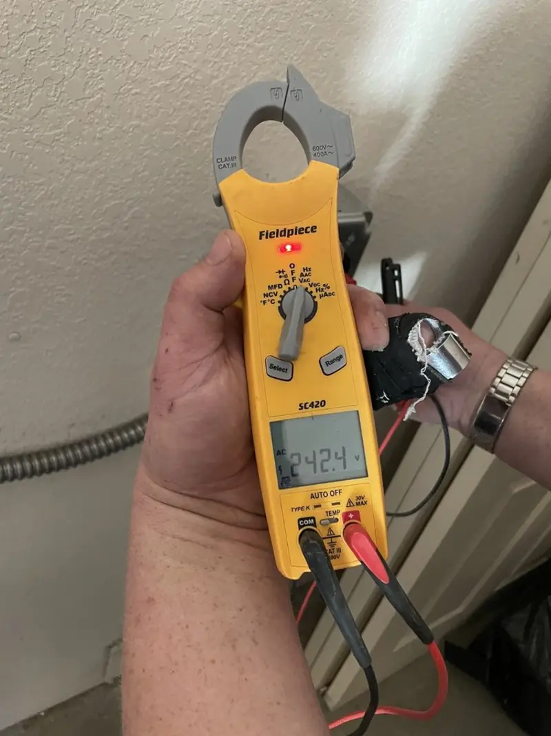 Voltage testing with clamp meter during Ceiling Fan Installation in Amory